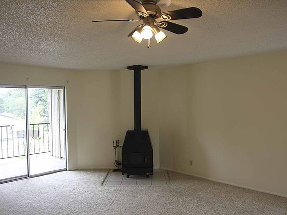 spacious living room with wood stove