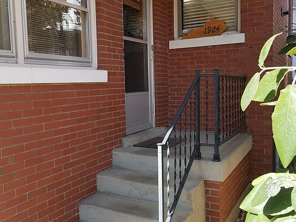 This is the rear entrance. Window to the left is dinette. Window to the right is the kitchen.