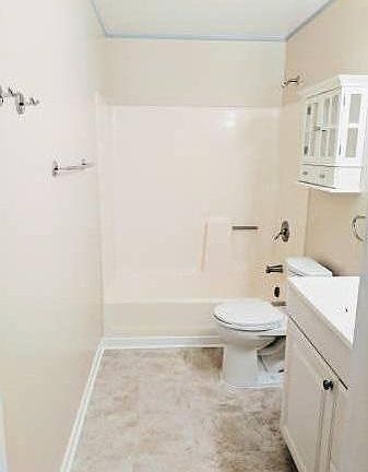Fully remodeled bathroom with new paint and flooring. Bottom right corner is just shadowed which is why the coloring looks off.