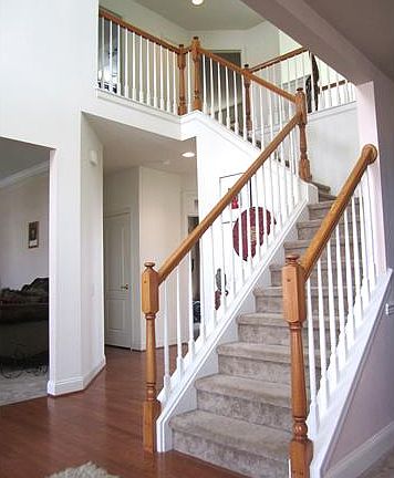 Foyer showcases a beautiful butterfly staircase