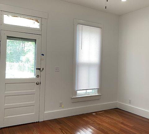 Front room designed as a bedroom. It could be used as an office or another living space if desired.