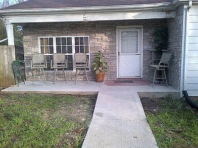 covered rock front porch