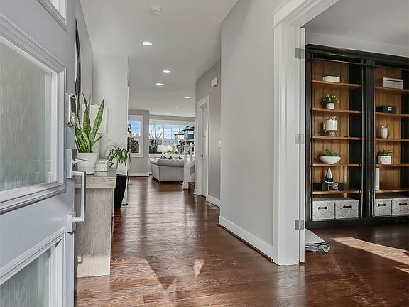 Grand Entry with High Ceiling and Deluxe Upgraded Chandelier >