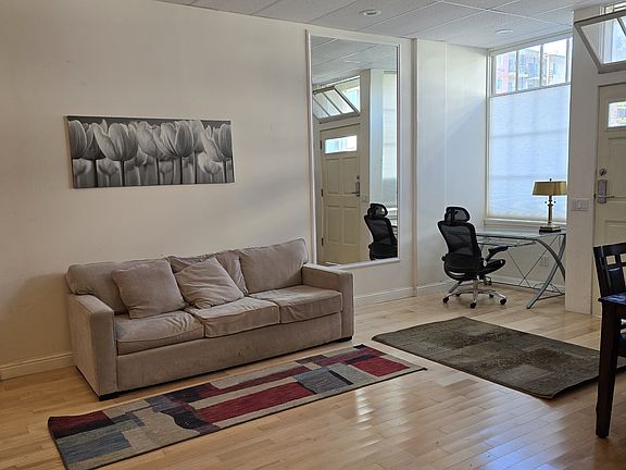 Looking from kitchen toward front door living area
