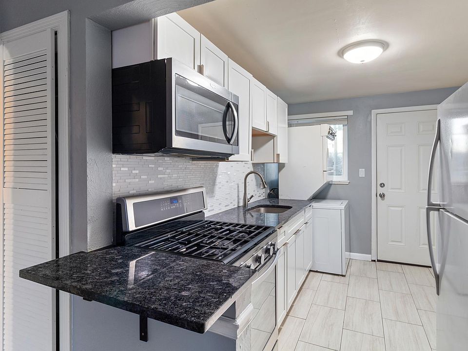 Granite countertops, tile floors, new cabinets and gas range.
