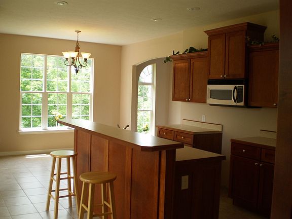 One of the Kitchen eating area with a beautiful view of the wooded back yard