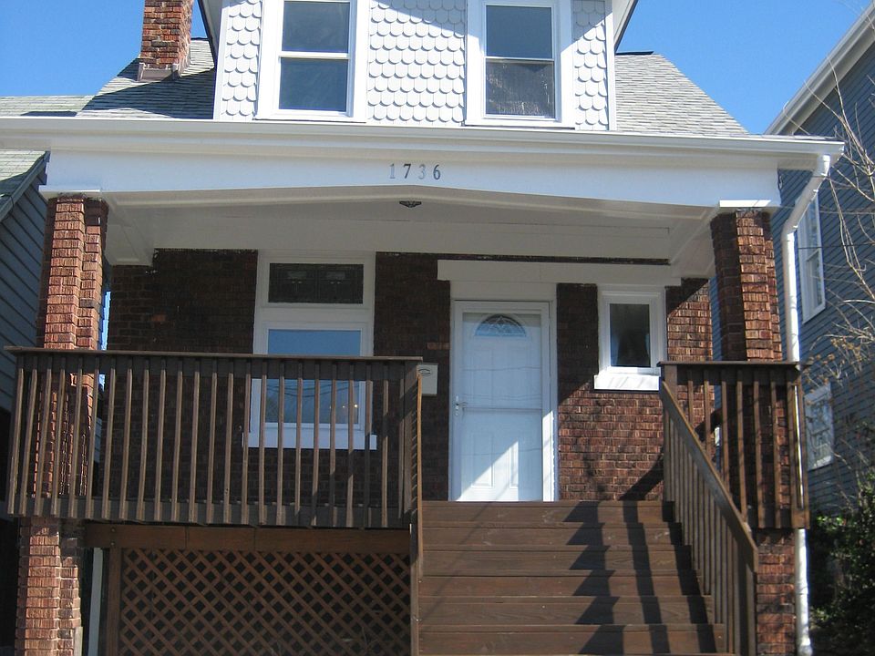 Completely rebuilt front porch with new front door.   New roof and siding.