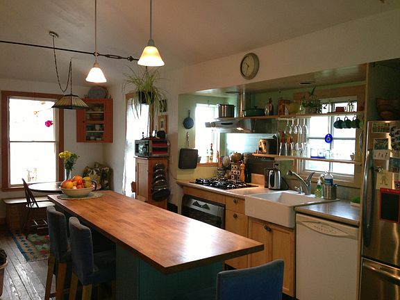 Gourmet kitchen with many small appliances and kitchen tools