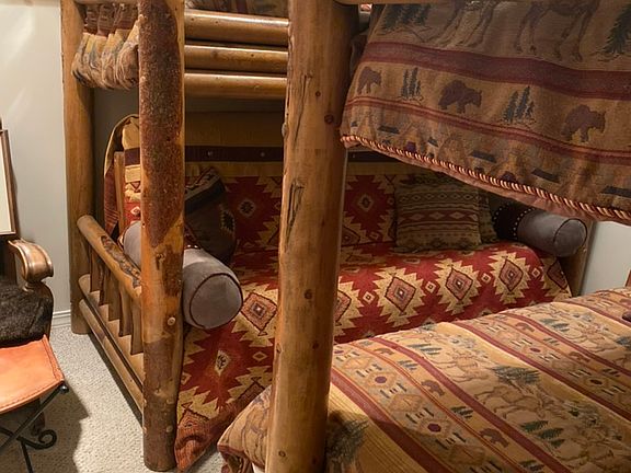 Fun bunk room has 2 twin over full bunks - lower bunks can be put in futon position