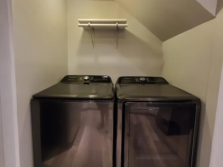 Brand new lighted laundry nook with state-of-the-art washer and dryer.