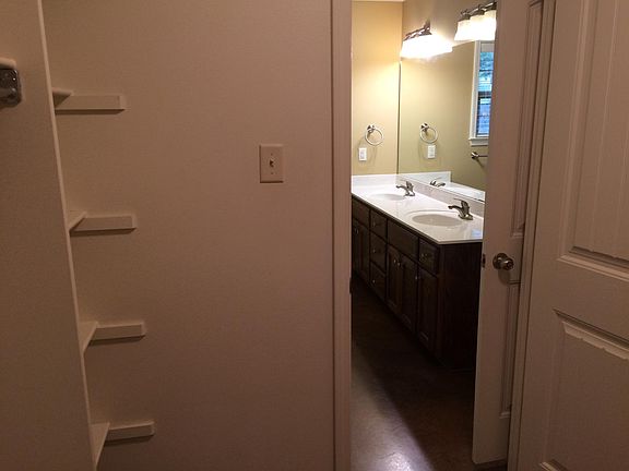 From walk in closet into bath