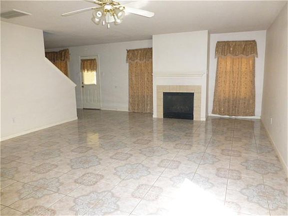 Large Living Area w/fireplace and tile flooring