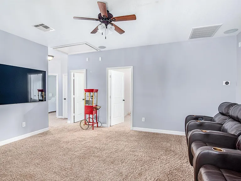 Large game room with built-in surround sound and plenty of space for movies or game night