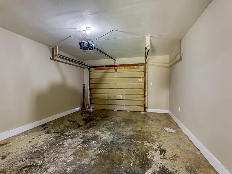 Large one-car garage with operating door.