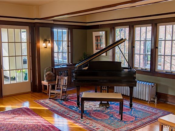 Consider that in 1910, the design of this home was a rare and exciting new American architecture style in Seattle. The heart of the home was open in contrast to most homes designed in this period. Happily, today it satisfies common current lifestyle wishes. The luxuriously sized living room, porch and dining room at the heart of this home have hosted many a large social function over more than 100 years.  It's ready to host your house warming party, next.