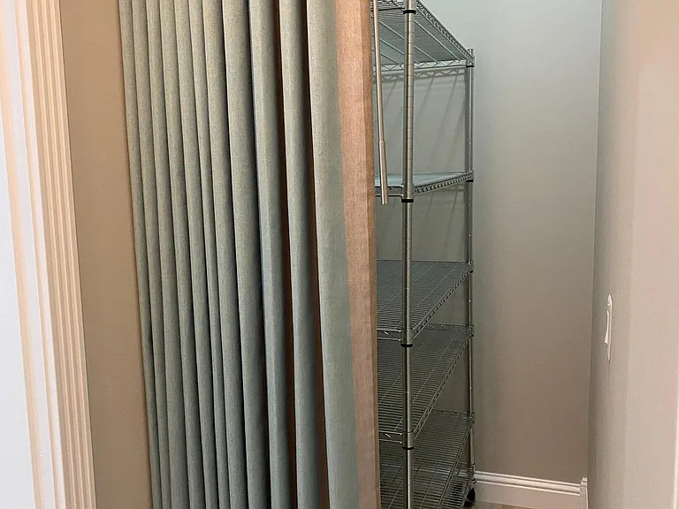 Storage/linen area at the end of hall.