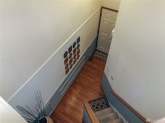 2 Story Entry Way with Bamboo Flooring which Continues throughout the Main Level. The Garage Entry is just off the Front Door.