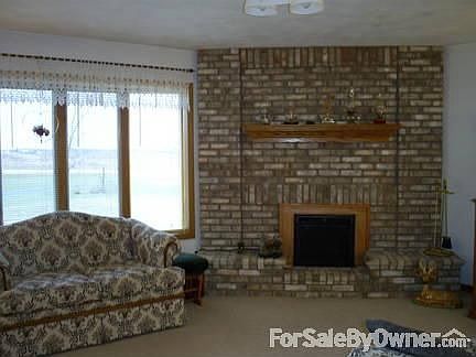 Snuggle Up By The Fire : large windows let in plenty of light