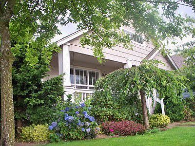 Craftsman Charm! Covered front Porch for visiting with neighbors and enjoying nature. Vaulted Ceilin