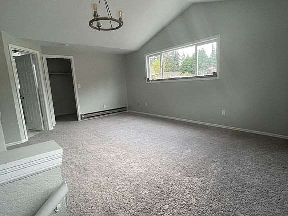 Large upstairs master suite with high ceilings and lots of light