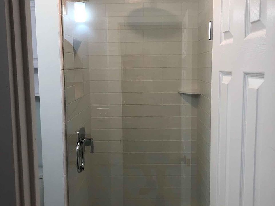 Custom Tile Shower with Rain Shower head and glass door