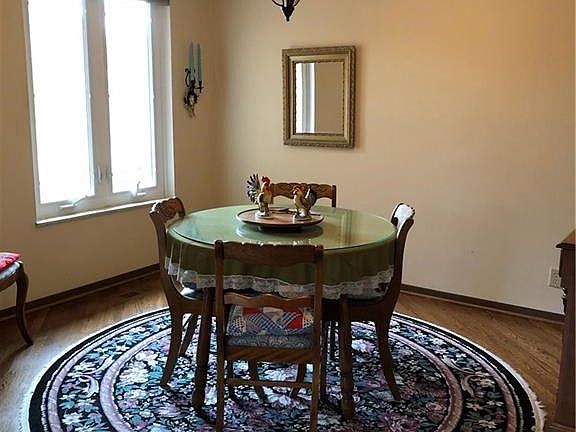 Dining room with hardwood flooring.