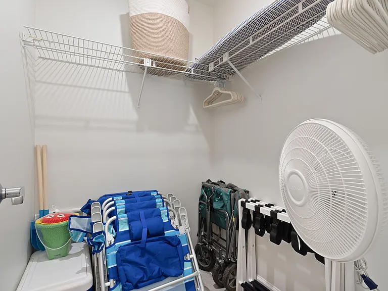 Luggage carriers and fans are also in the bathroom closet.