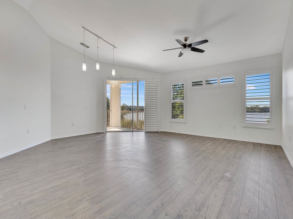 Hurricane shutters and vaulted ceilings are sure to impress!