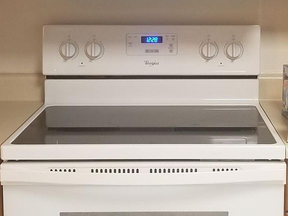 Glass top stove and microwave.