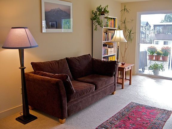 Living room, with view to deck and sliding door.