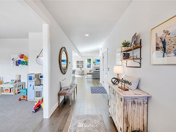 Front entrance with hardwood floors and  large formal Dining/Flex room to the left of the photo. 