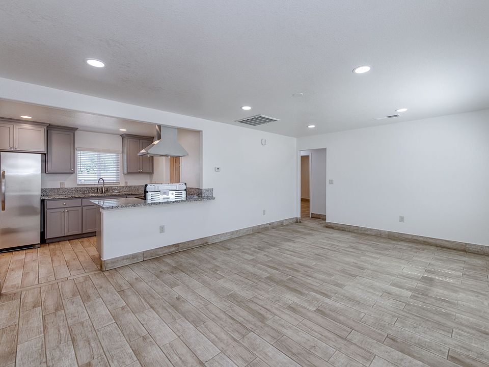 Large Living Room, All Tile Floors, Central Heating and Air Conditioning, Updated Fixtures and Custom Kitchen.