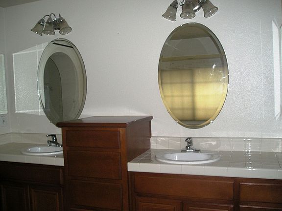 Double sinks and lot of cabinets in the master bath