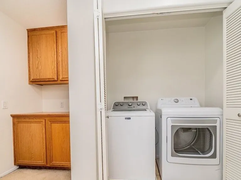This picture shows the area upstairs, next to the Master bedroom. It has the laundry area and additional storage. The house is includes the washer and dryer with the rent.