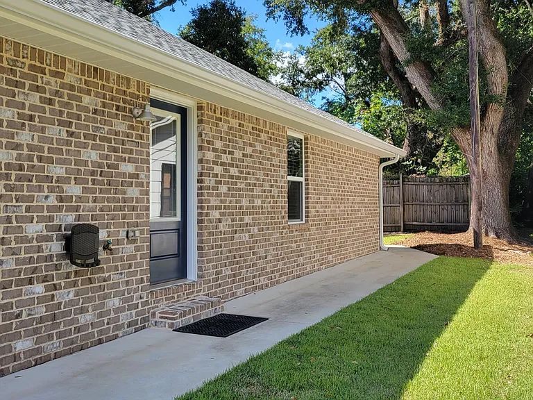 Side door entry and exit off kitchen.