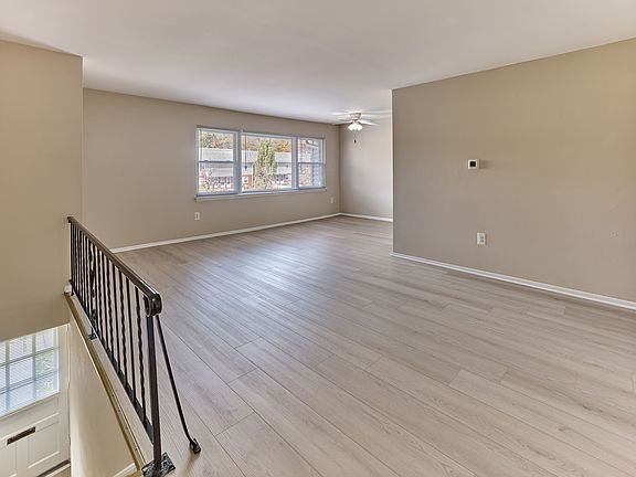 Modern, open living spaces with stylish flooring and natural light at Maple Grand Apartments in Maple Shade, NJ.