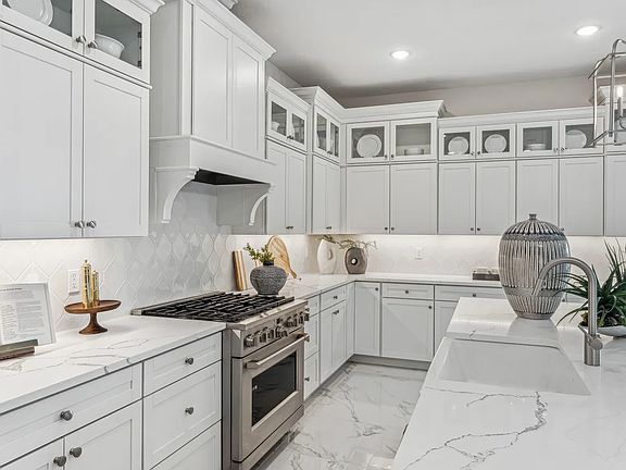 Kitchen with glass upper cabinets