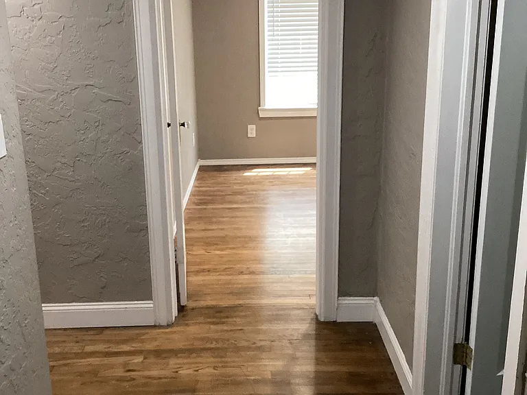 Hallway between SW and SE bedrooms. Bathroom is on the right between the bedrooms.