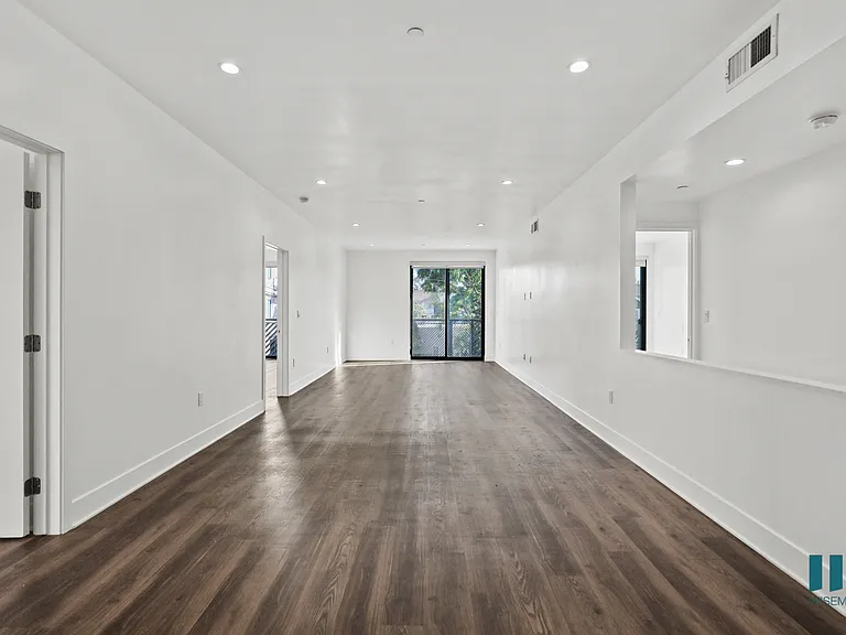 Open-Concept Living and Dining Room Space with Patio
