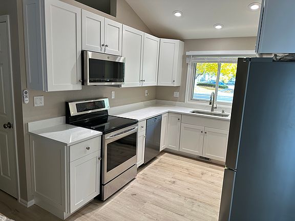 GE Over Oven Micro. LG Stove, smooth top. Miele Dishwasher. Large Undermount Stainless Sink, with Delta Faucet.