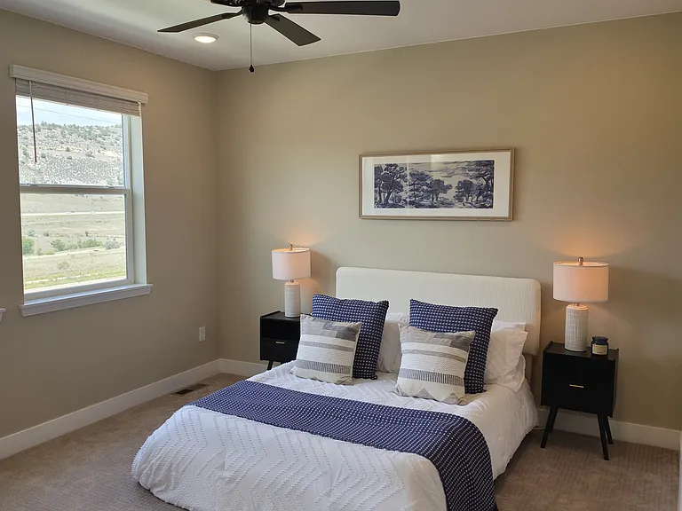 Spacious master bedroom with mountain views