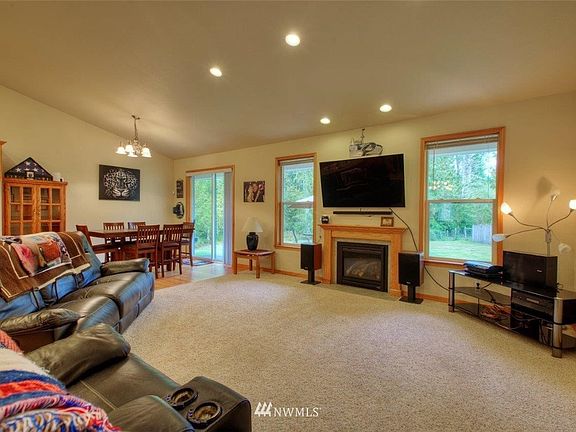 Spacious living room with territorial view of backyard.