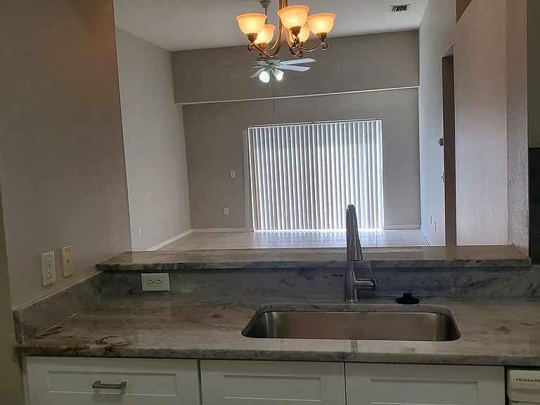 Kitchen looking into Dining and Family Room.