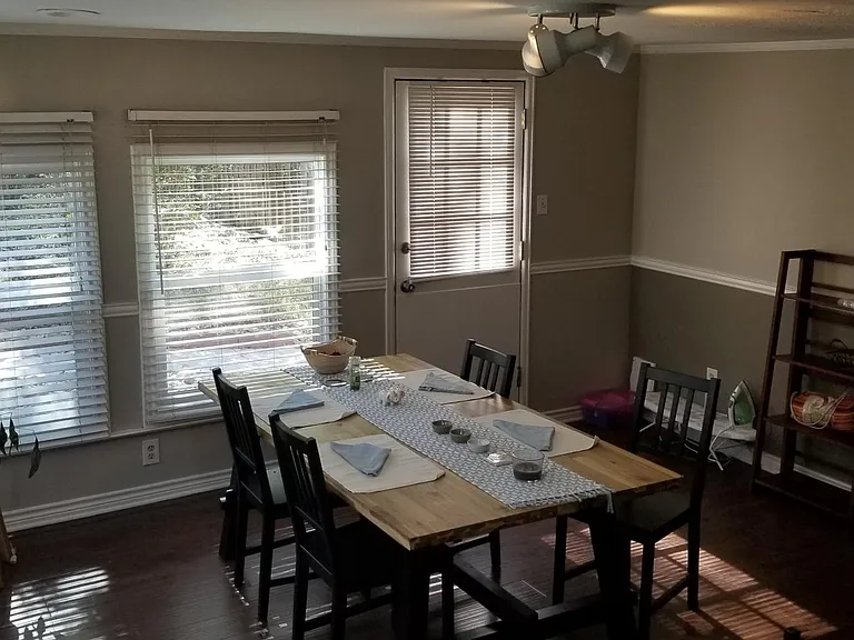 Back room (#2). Has been used as a bedroom, as an office, and currently being used as a dining room. *Apt is unfurnished and has new flooring and lighting.