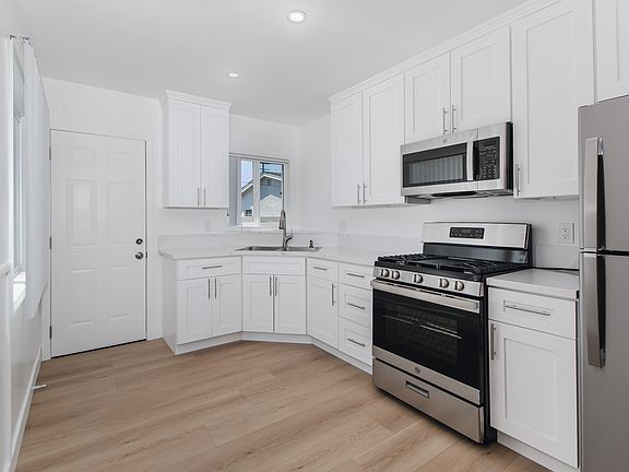 Renovated Kitchen with brand new cabinets, and appliances.