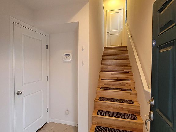 Entry. Garage on left, stairs to main level.