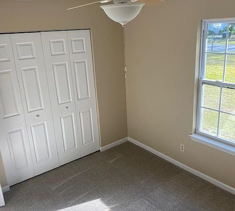 Front Bedroom with new carpet and ceiling fan