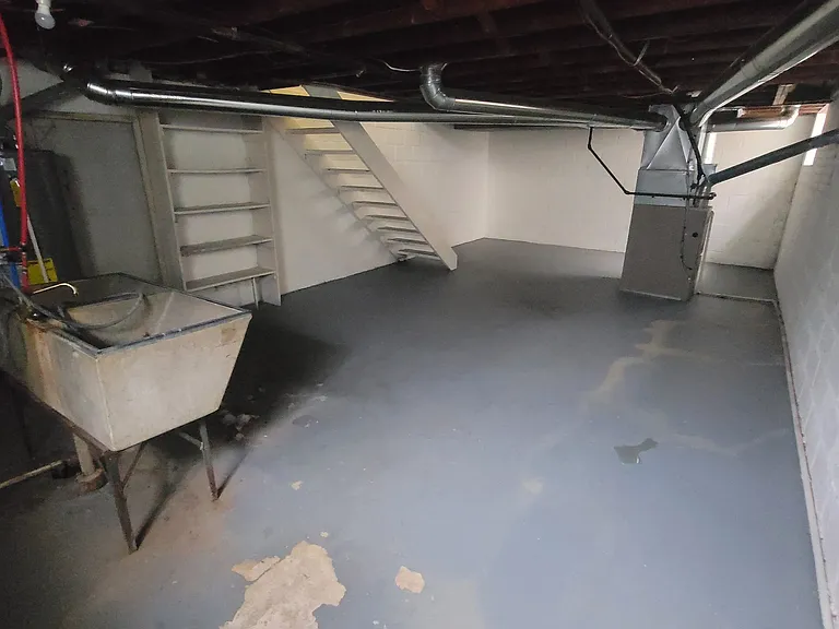 Lower Level has Storage Shelving, Washer / Dryer Hookups & Utility Sink