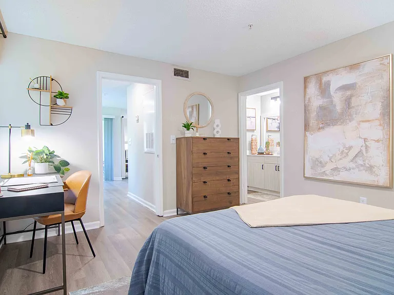 Large and efficient bedroom featuring a compact workspace,