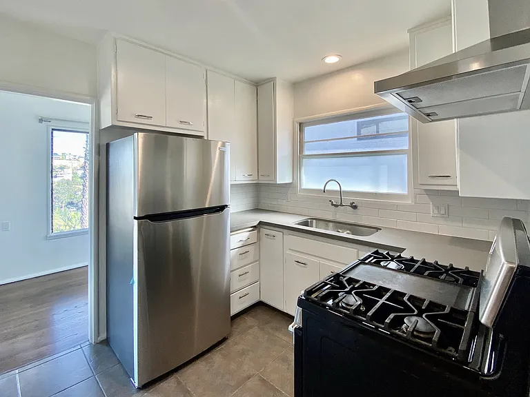 Kitchen has direct access to the dining room.